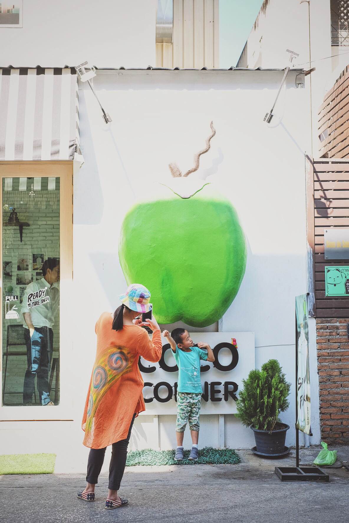 Coconut Hero posing in front of this very popular shop selling all things coconut, soi 13.